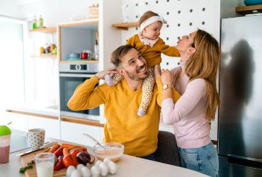 happy-family-preparing-healthy-food-together-in-ki (1)
